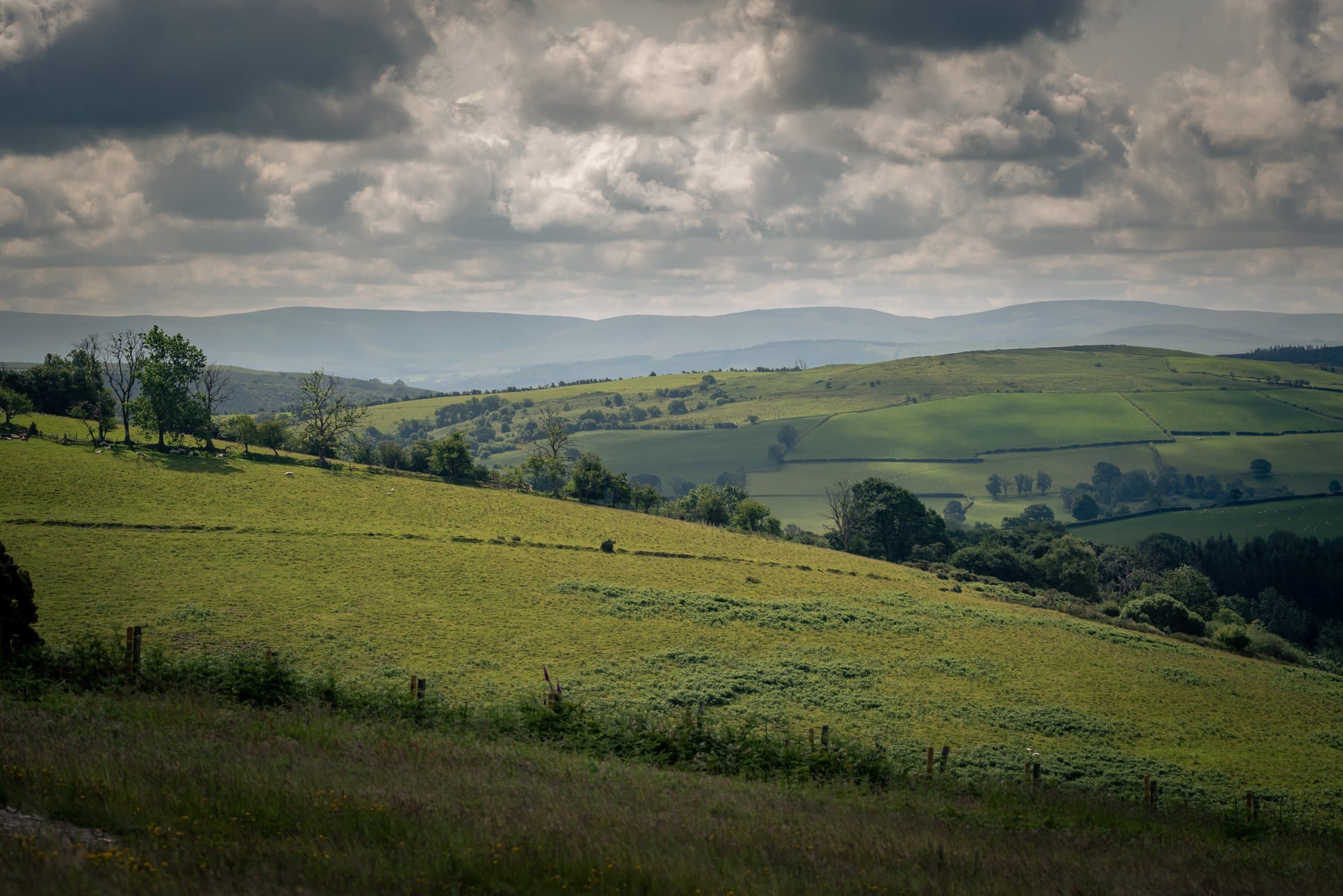 Wide Carmarthenshire hills landscape with dramatic cloud