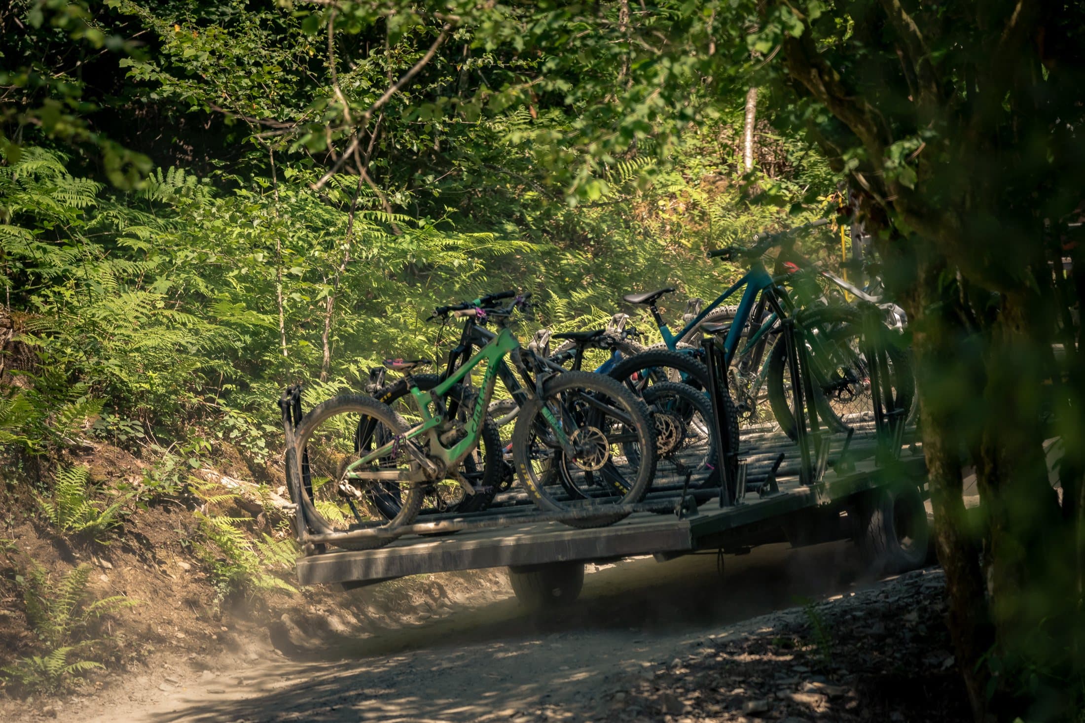 Bikes racked on the uplift trailer ready to go up