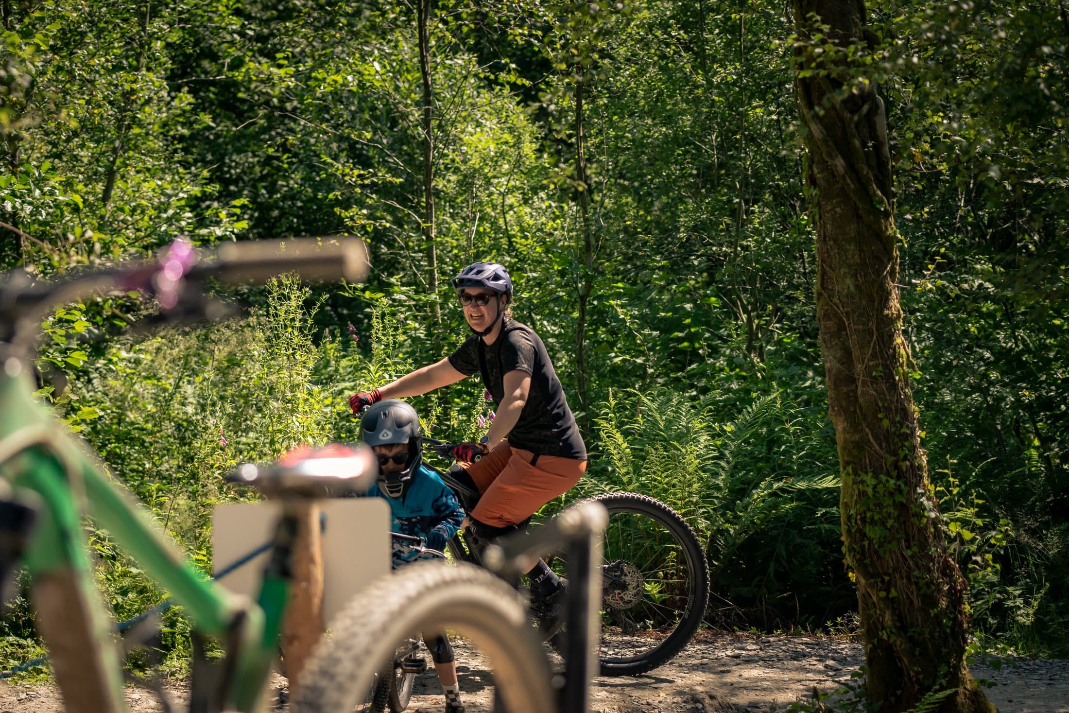 Rider alongside the uplift vehicle in the woods
